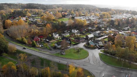 Aerial,-suburb-community,-car-driving-on-road,-in-Gothenburg,-Sweden