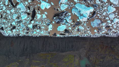 Aerial-View-Of-Svinafellsjokull-Glacier-Near-Skaftafell-In-South-Iceland-With-Icebergs-Floating