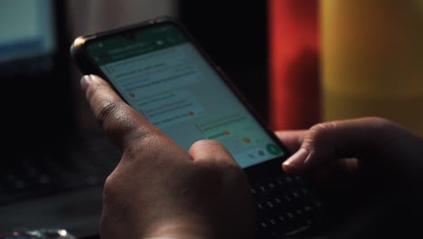 Close-up-shot-of-person-typing-message-with-finger-on-smartphone-screen-in-WhatsApp