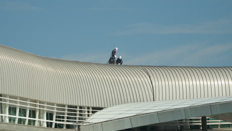 Repairmen-At-Work-On-The-Roof-Of-Jeju-International-Airport-In-South-Korea