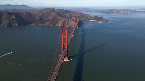 Aerial-view-of-the-Golden-gate-bridge,-sunny-fall-day-in-CA,-USA---rotating,-pull-back,-drone-shot
