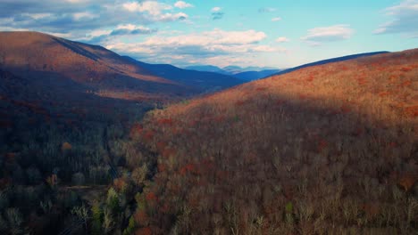 Aerial-drone-video-footage-of-the-magical,-beautiful-Appalachian-Mountains-during-fall-autumn-with-beautiful-golden-light-and-skies
