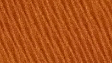Tangerine-Color-Plain-Textured-Fabric.---Closeup-Shot