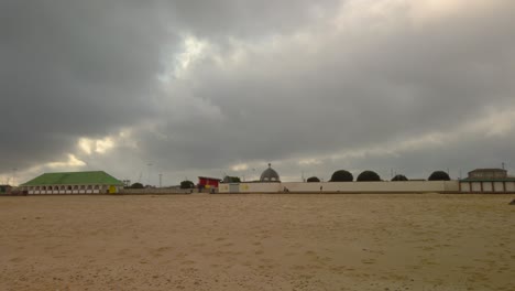 Great-yarmouth-pleasure-beach-in-a-cloudy-day-at-Norfolk,-England---sun-peeking-from-cloudscape