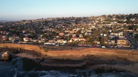 San-Diego-Cliffs,-Establishing-Drone-Aerial-View-of-Upscale-Coastal-Neighborhood-on-Sunset-Sunlight,-California-USA