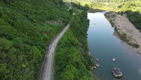 Drone-shot-of-river-and-small-road
