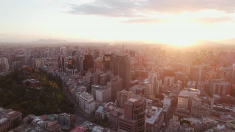 Glowing-sunrise-aerial-view-over-Santiago-Chile-urban-skyscrapers-cityscape-metropolis