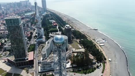 Majestic-Alphabet-tower-of-Batumi-city,-aerial-drone-orbit-view
