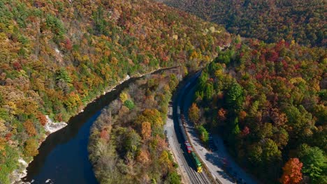 Aerial-of-train-locomotive-in-mountain-pass-in-USA