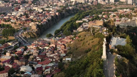 Kartlis-Deda-Monument-in-Tbilisi-city,-aerial-orbit-view