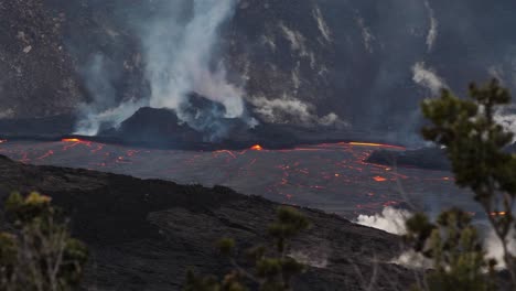 Light-gray-smoke-and-steam-rises-off-the-centralized-spot-of-magma-buildup-|-lava-volcano-national-park-outdoor-hot-extreme