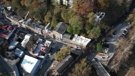 Aerial-View,-Freight-Cargo-Train-on-Historic-Railroad-in-Ellicott-City,-Maryland-USA