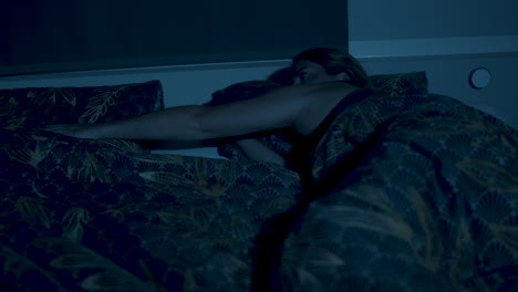 Woman-placing-her-hand-on-the-empty-side-of-bed-and-falling-asleep---2