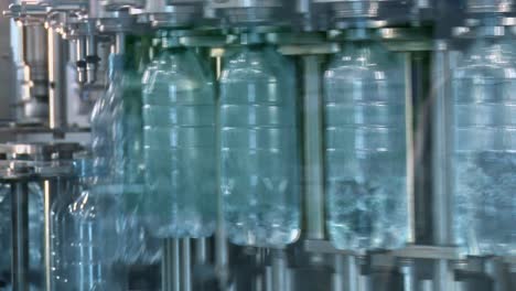 New-plastic-bottles-on-the-conveyor-belt-of-a-drinking-water-plant