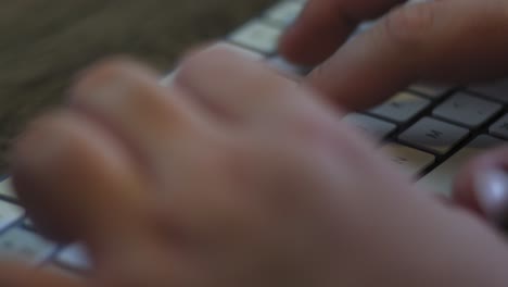 Man-types-on-a-wireless-keyboard-extreme-close-up-with-copy-space