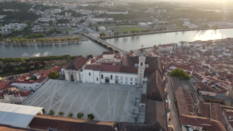 aerial-top-down-view-orbit-over-Coimbra-university-of-law,-Mondego-river-Backgound