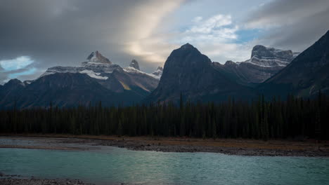Time-Lapse-of-Pristine-Nature-of-Canada,-Clouds-Moving-Above-Glacial-River-and-Snow-Capped-Peaks-by-Icefields-Parkway-Scenic-Route