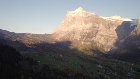 aerial-drone-footage-rising-down-and-hiding-beautiful-sunset-views-of-Mount-Wetterhorn