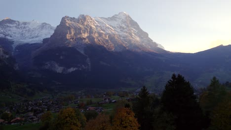 aerial-drone-footage-rising-down-and-hiding-picturesque-view-of-Mount-Eiger-and-Grindelwald-in-Switzerland