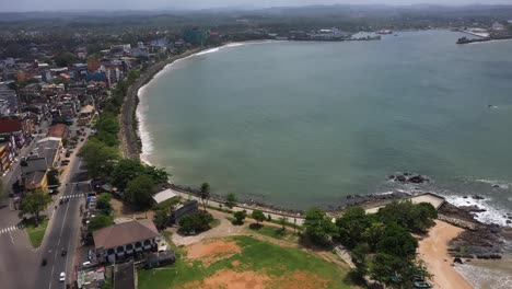 Aerial-rising-over-historic-Galle-Fort-with-ocean-and-city-in-Galle-in-the-south-coast-of-Sri-Lanka