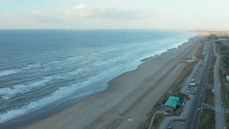 Waves-Crashing-In-The-Sandy-Beach-Of-Zandvoort-In-The-Netherlands---Aerial-shot
