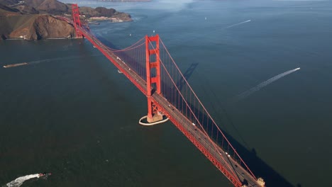 Aerial-view-above-the-old-iconic-Golden-gate-bridge,-in-sunny-San-Francisco,-USA---high-angle,-tilt,-drone-shot