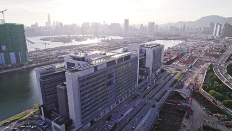 Aerial-drone-shot-over-Hong-Kong-Children's-Hospital-is-a-children's-hospital-and-future-new-acute-hospital-at-Kai-Tak-Development-area,-June-2022