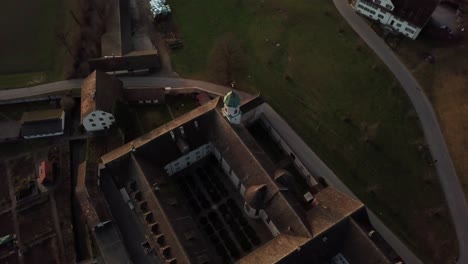 Aerial-drone-shot-orbiting-increasingly-around-Fahr-Monastery-in-Unterengstringen,-Switzerland-60fps