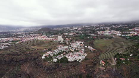 Aerial-orbit-panorama-of-Gordejuela-town,-green-landscape