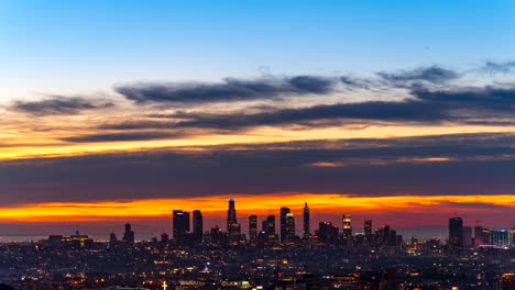 Stunningly-colorful-sunrise-over-the-Los-Angeles-skyline---night-to-day,-holy-grail,-wide-angle-time-lapse