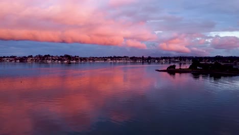 Massive-clouds-formation-durring-sunset-over-the-water-at-Sylvania-Waters