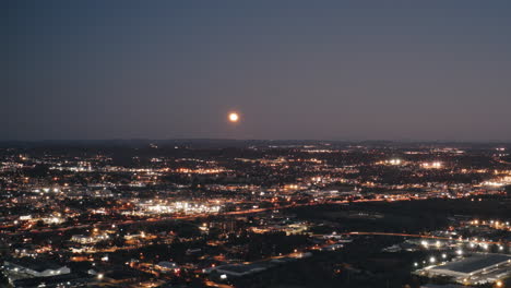 Aerial-timelapse-of-chattanooga,-tennessee-following-the-moon-rise-and-traffice