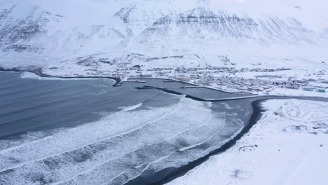 Winter-Scene-At-Olafsfjordur-Town-In-Northern-Iceland---aerial-drone-shot