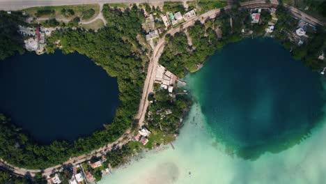 Overhead-Shot-Of-Two-Beautiful-Ponds-With-Green-Trees-All-Around,-Bacalar-,-Mexico