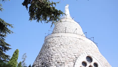 Beautiful-Lady-of-Lebanon-Monument-Statue-in-Harissa,-Low-Angle-Reveal