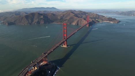 Aerial-view-away-from-the-iconic,-Golden-gate-bridge---circling,-reverse,-drone-shot
