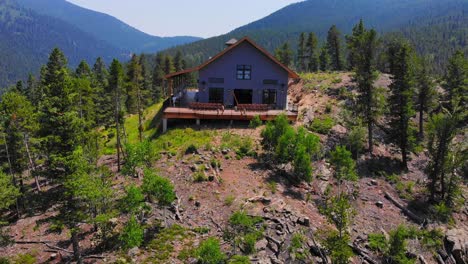 Lonely-Isolated-House-Cabin-On-Vast-Alpine-Woodlands-Mountain-Hill-Peak