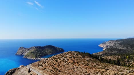 The-road-to-Assos-Kefalonia-Island,-Greece---aerial-drone-shot