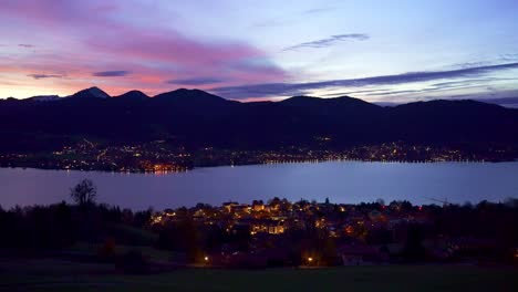 Dusk-and-sunset-view-over-Tegernsee,-a-town-and-lake-in-the-mountains-of-the-alps