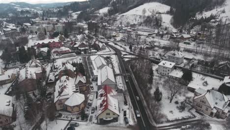 Aerial-View-of-a-Small-Mountain-Town-in-the-Winter-Time-4K