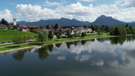 Hopfensee-lake-and-town-waterfront-Hopenfen-Swabia-Bavaria-Germany-drone-aerial-view