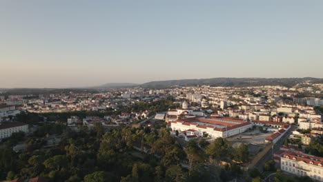 Aerial-flying-towards-Coimbra-Prision-establishment-Building,-Cityscape-Horizon