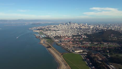 Aerial-drone-view-towards-the-San-Francisco-skyline,-in-sunny-California,-USA