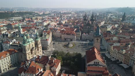 Wide-drone-shot-of-the-old-town-square-in-prague-czech-republic-on-a-slightly-humid-day