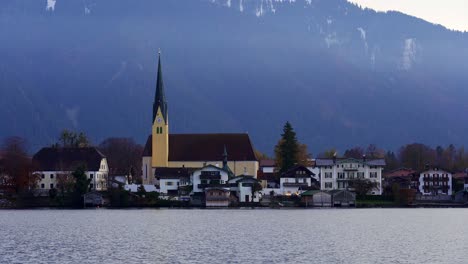 Close-up-view-of-a-church-across-the-waters-of-Tegernsee