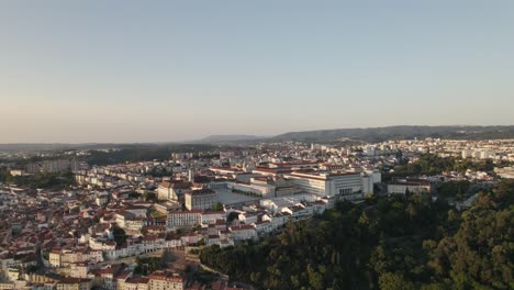 Establishing-aerial-circling-view-of-Coimbra-in-Portugal-with-Mondego-river-in-background