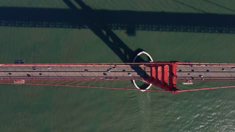 Aerial-view-above-traffic-on-the-Golden-gate-bridge,-in-SF,-USA---top-down,-drone-shot