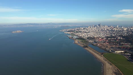 Aerial-view-of-the-San-Francisco-cityscape,-in-sunny-California---tracking,-drone-shot