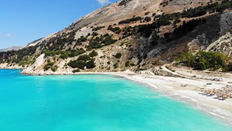 Paradise-sandy-beach-of-Agia-Kiriaki-with-emerald-clear-sea-in-South-Milos-island,-Cyclades,-Greece---aerial-drone-shot