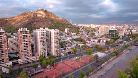 Aerial-Drone-Top-Notch-Above-Santiago-de-Chile-Historic-Center,-San-Cristobal-Hill-Urban-Park,-South-America-Capital-City-during-Afternoon-Sky,-Panoramic,-Horizon